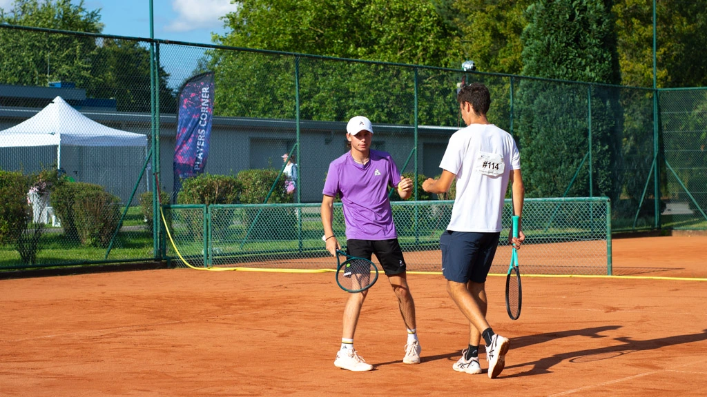 Two male college tennis players